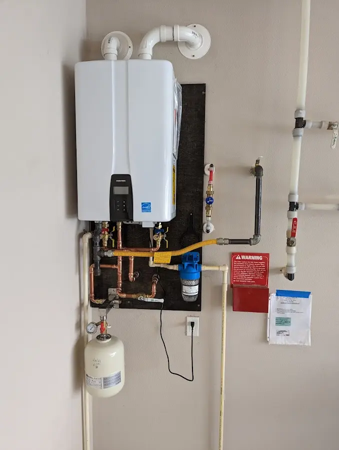 Professional plumber installing copper piping in a Chatsworth home